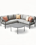 Hoekbank met kussens en ronde tafel van aluminium in lichtgrijs 250 x 250 x 85cm